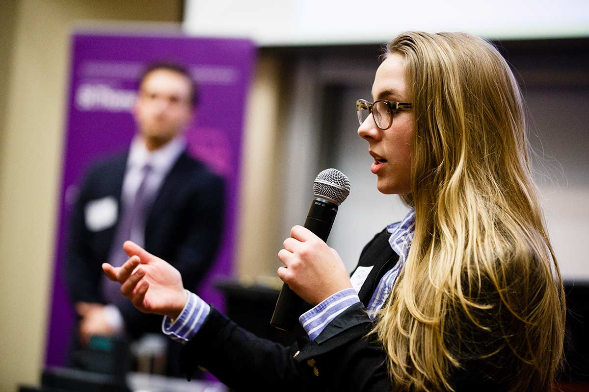 Student speaks during the Opus College of Business business plan competition 
