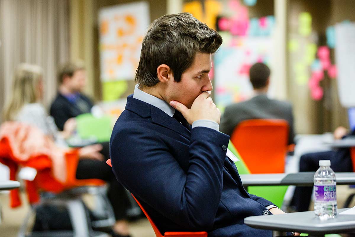 Student thinking after his presentation during the Fowler Business Concept Challenge