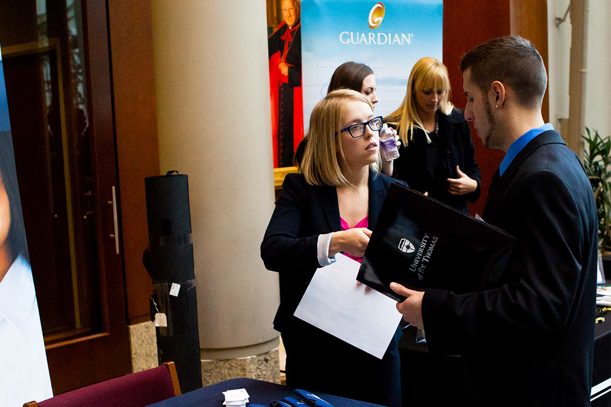 Students engage with employers at the a career fair. 