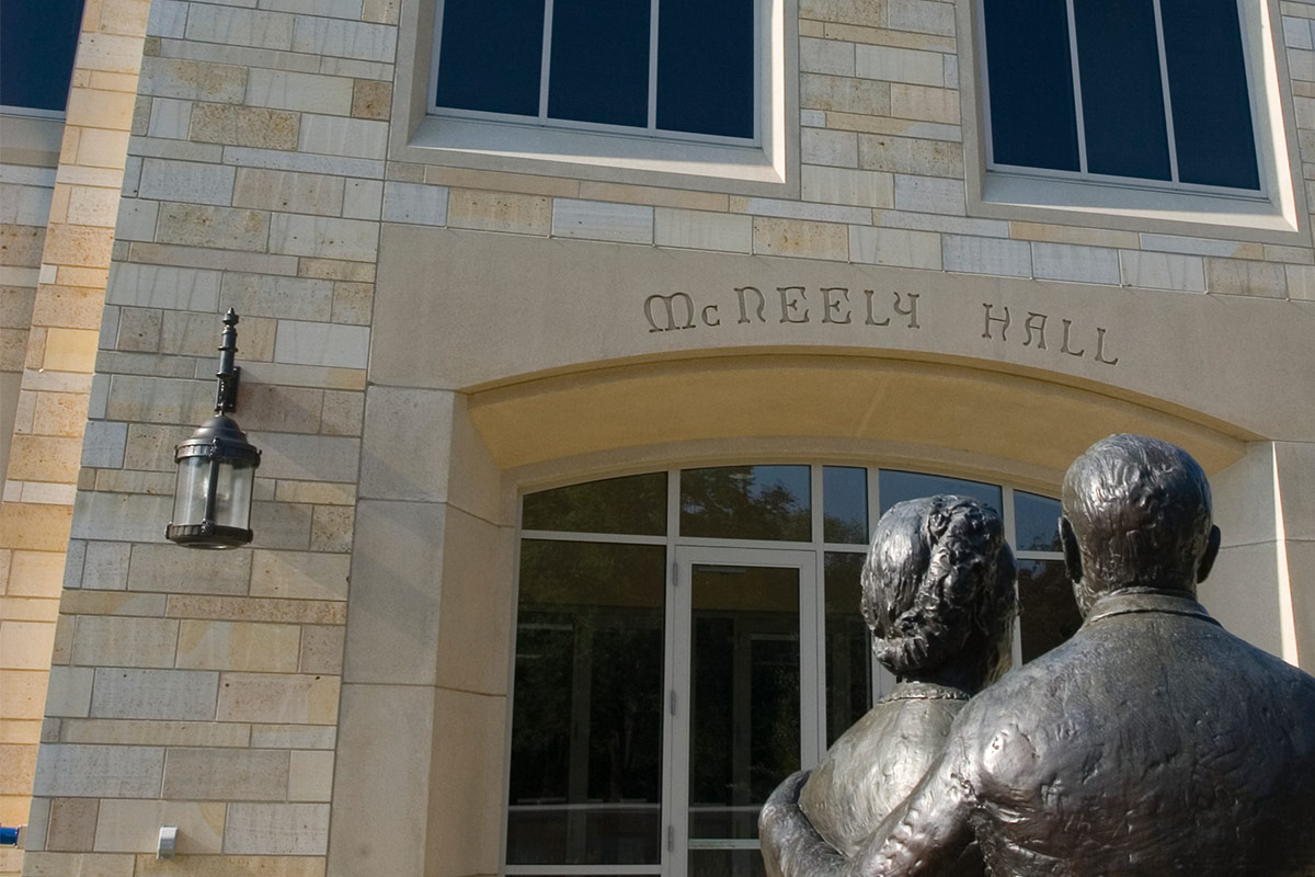 McNeely Hall exteriors with sculpture in front of building.