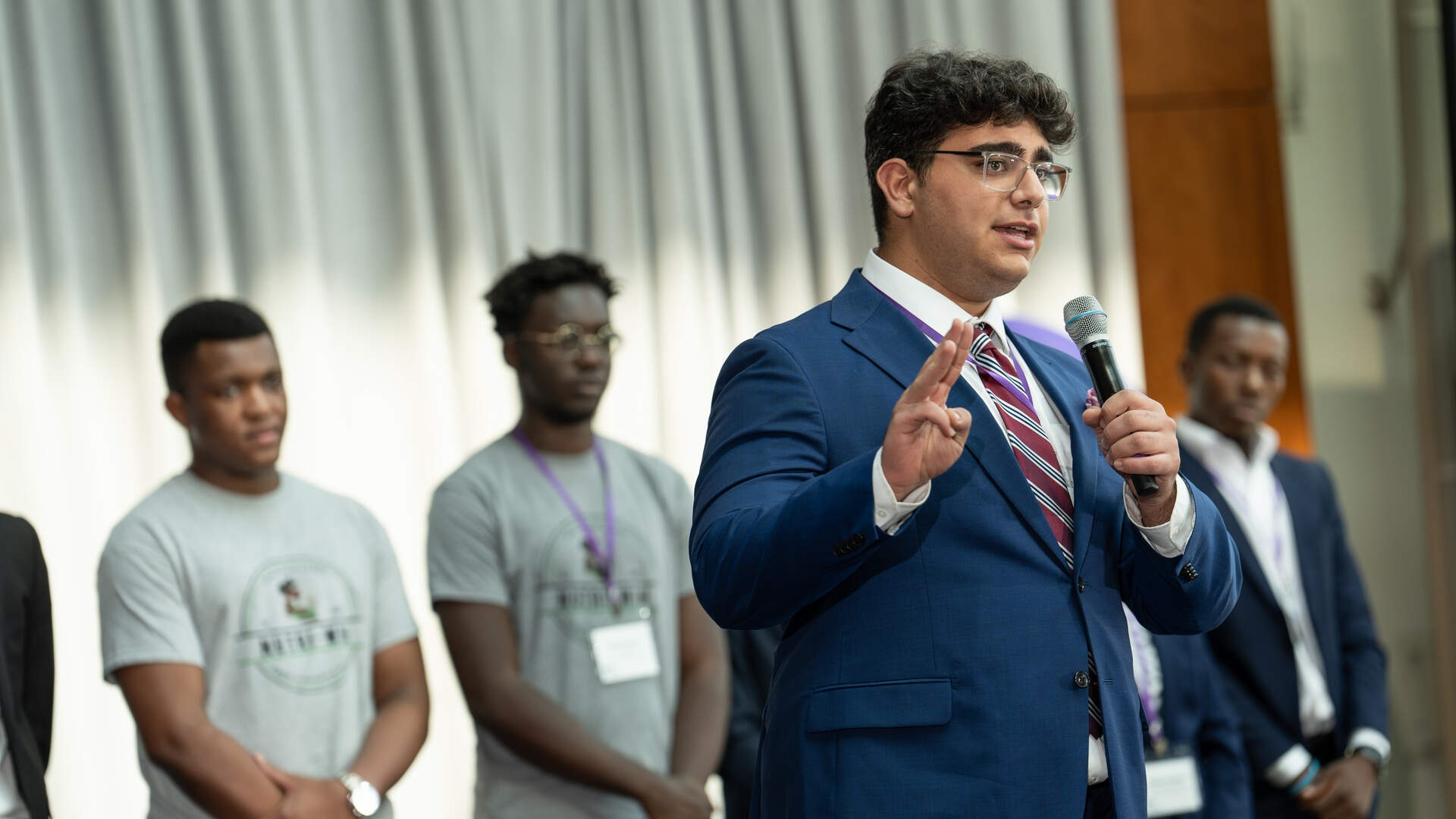 Student Georges Macheta competing at an entrepreneurship competition at the Schulze School of Entrepreneurship