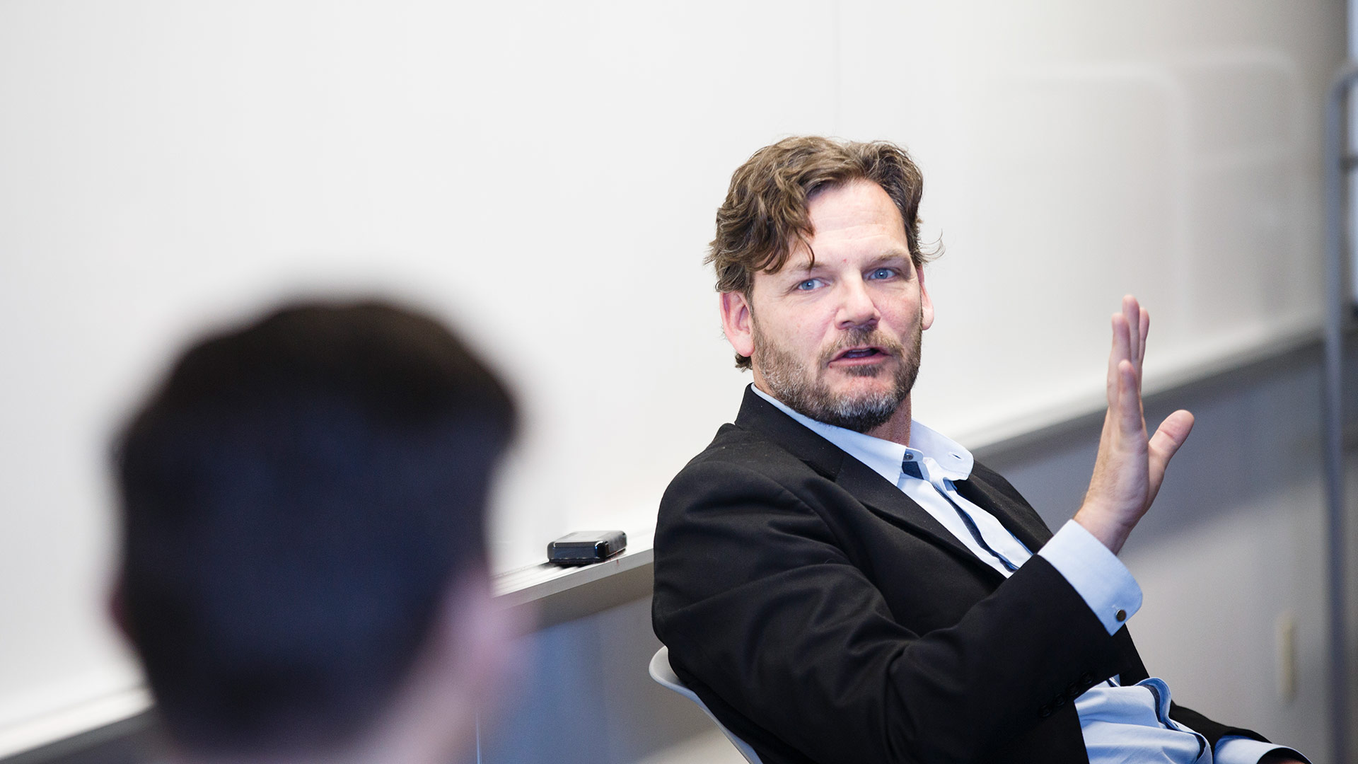 Professor Alec Johnson gives feedback during student presentations during a Foundations of Entrepreneurship class in a "smart classroom" in Schulze Hall 420 in downtown Minneapolis on April 14, 2015.