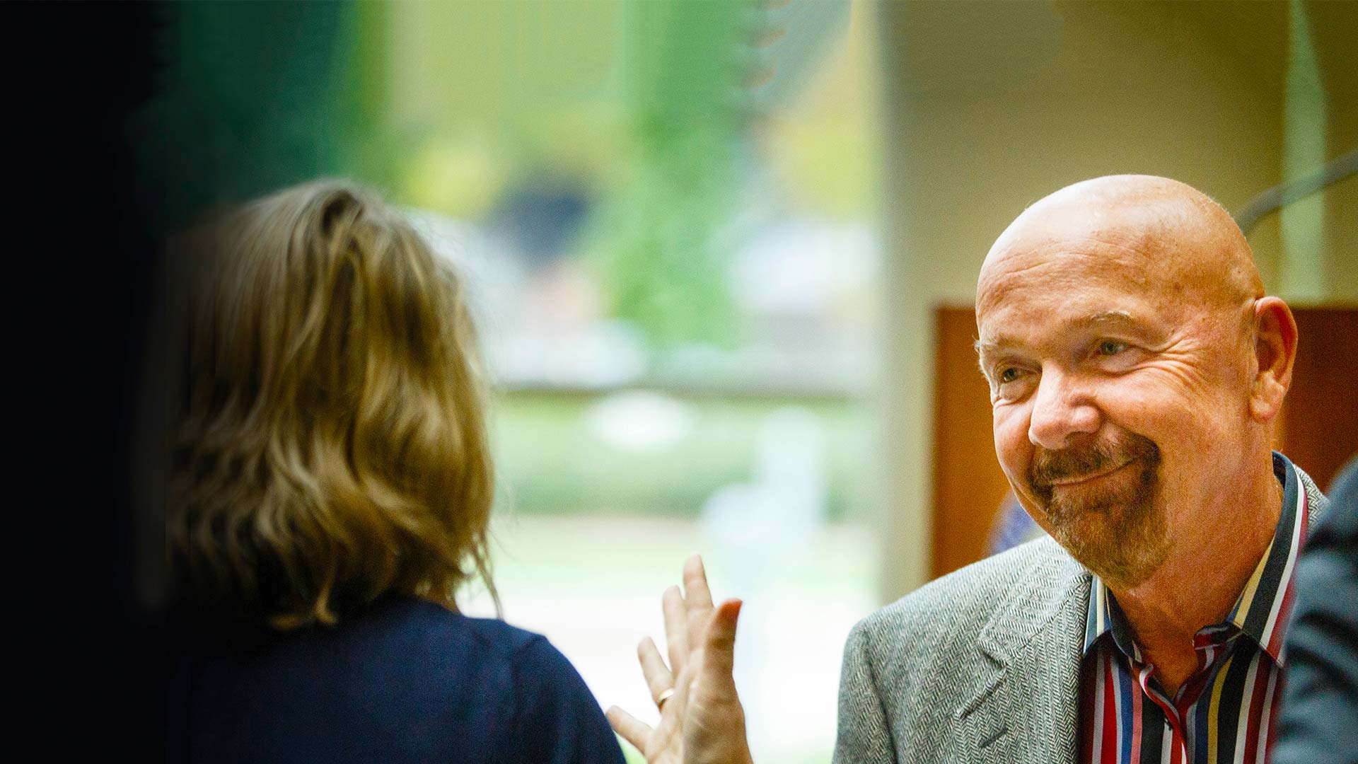 Trustee Richard (Dick) Schulze talks with guests during a reception.