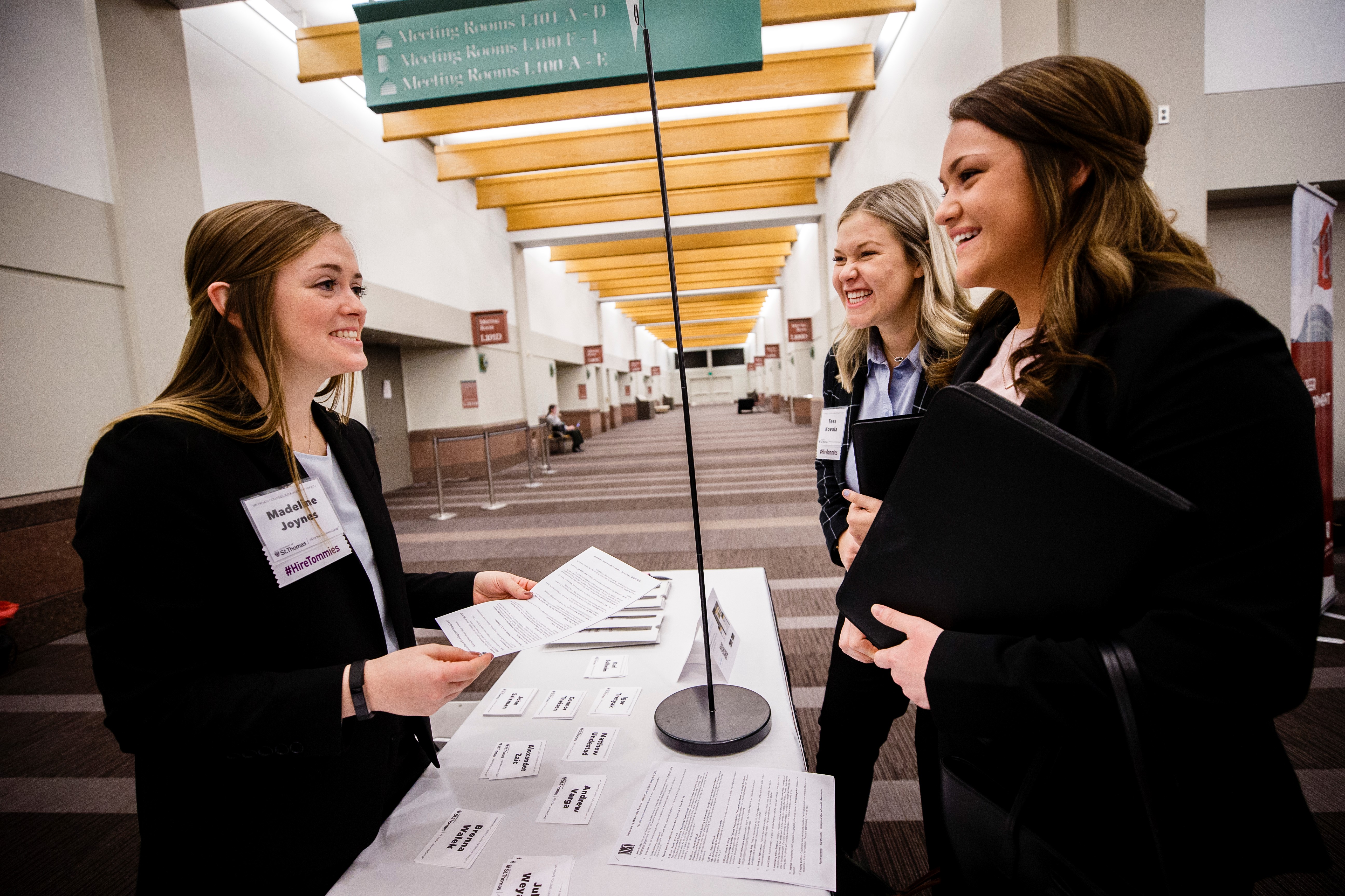 Two students register for a career fair