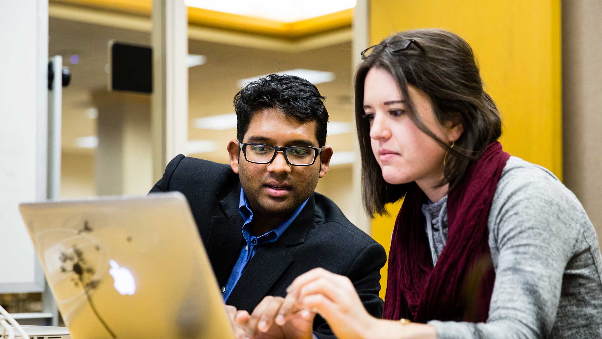 Part-time MBA students work on a project in the MBA study lounge in Terrence Murphy Hall.