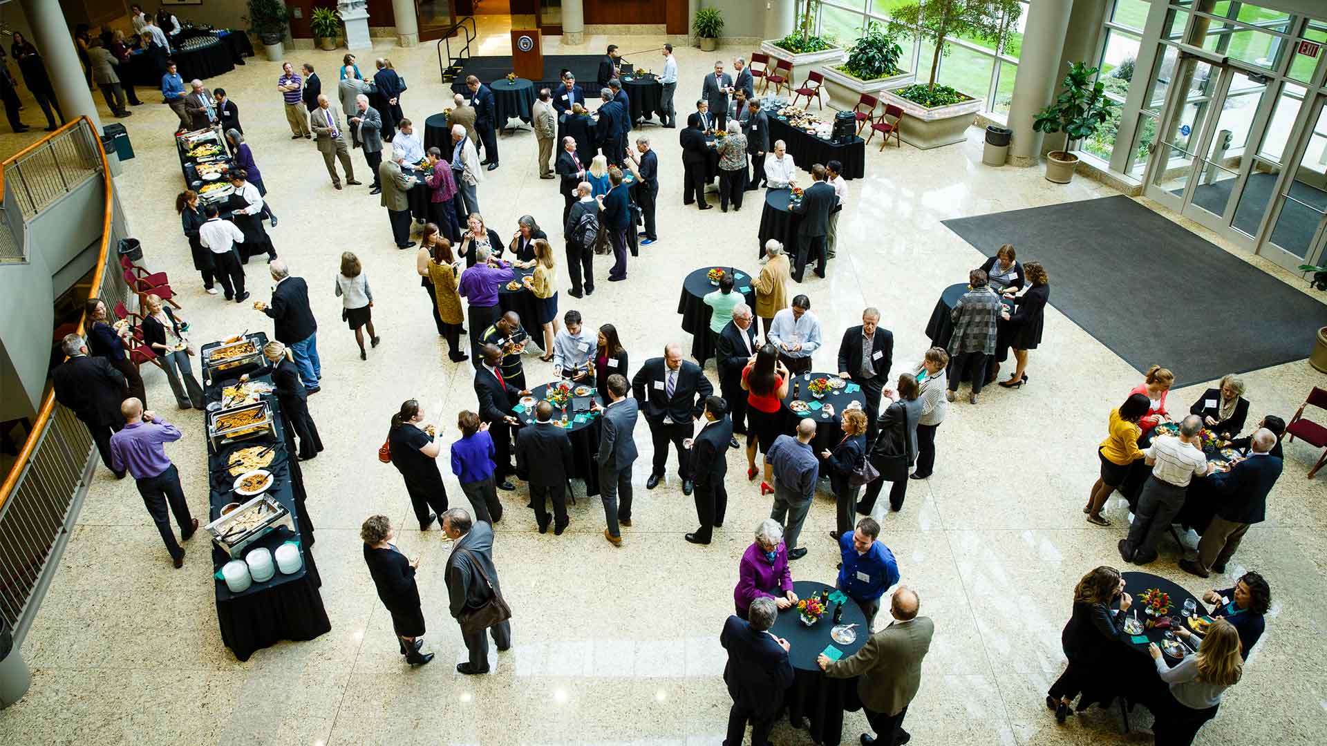 Looking down in atrium where attendees socialize during a reception