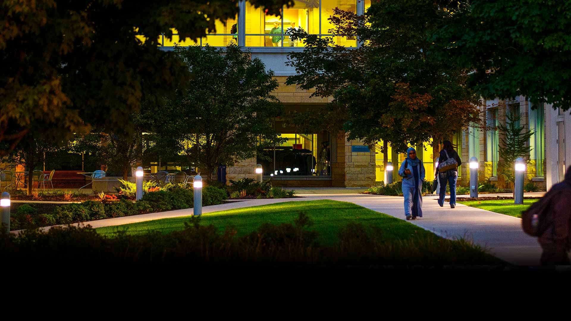 Students walking in front of the Terence Murphy Hall