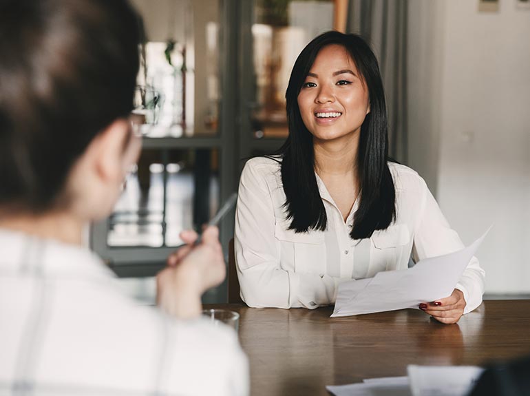 Business woman talking during job interview.