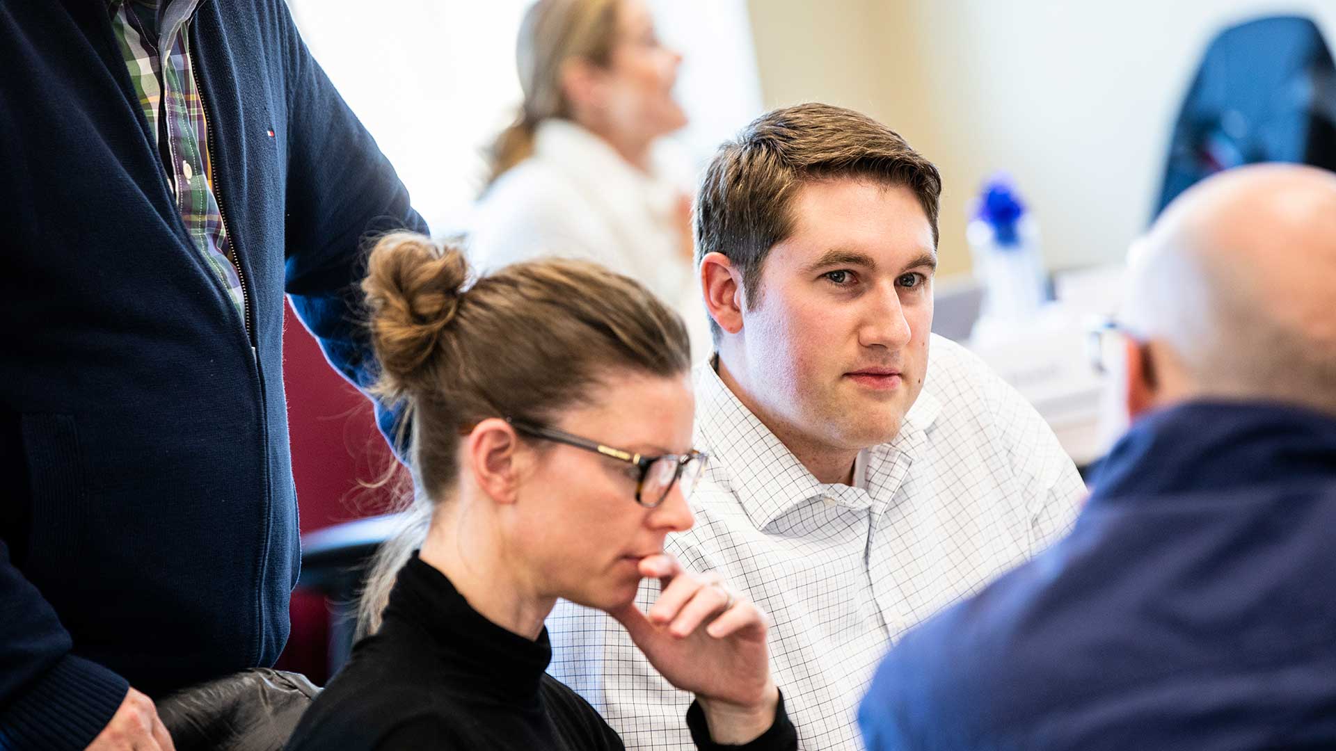Students work on a group exercise during an Executive MBA Class in Schulze Hall in Minneapolis.