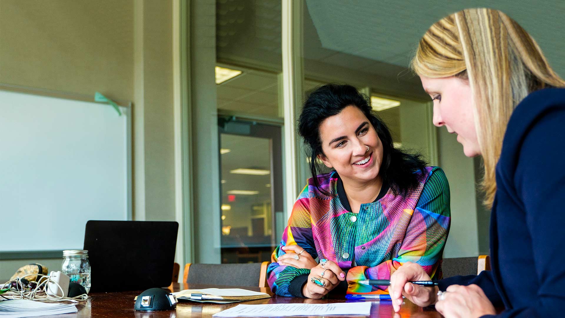 Career and Professional Development staff member Monica Gould (right) talks with alum Saarah Berenjian during a staged scene.