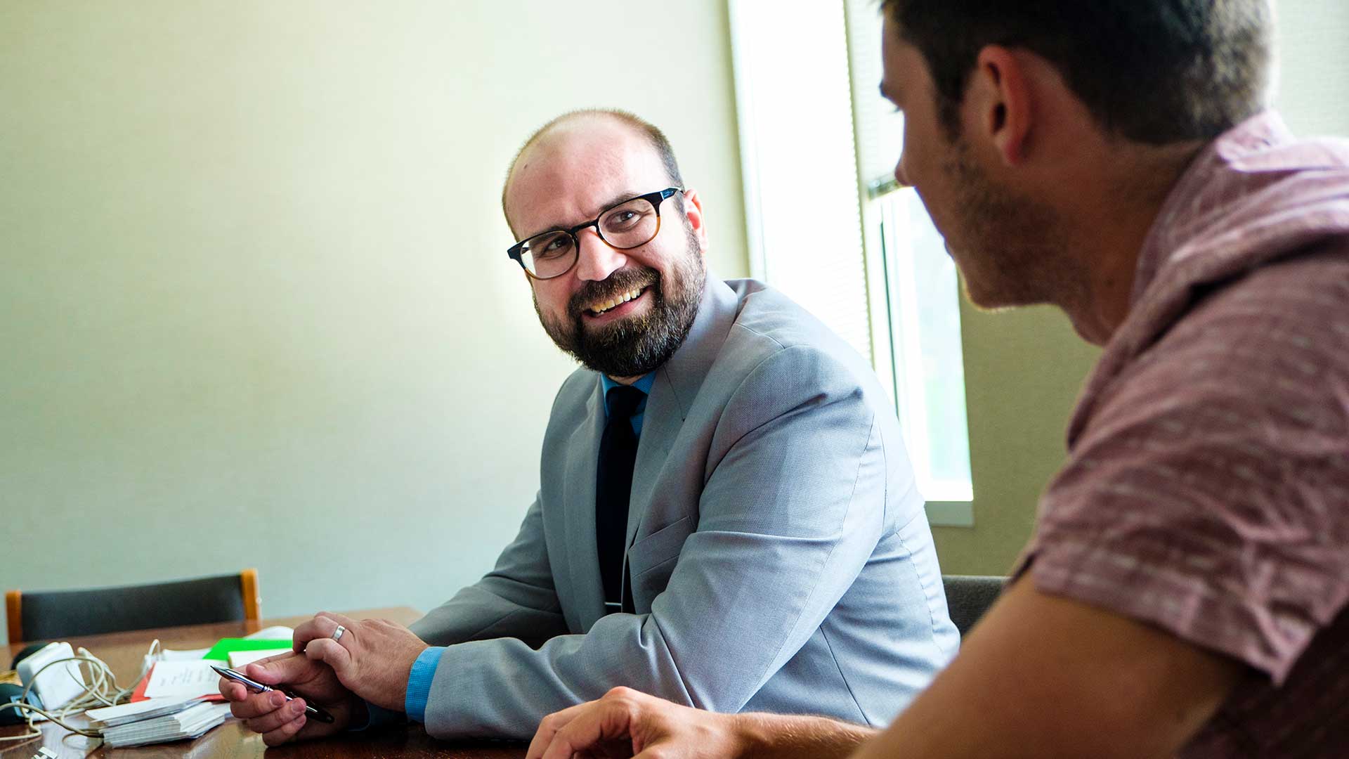 Staff member Dan Winterlin (left) talks with alum John Pavelko during a staged scene.