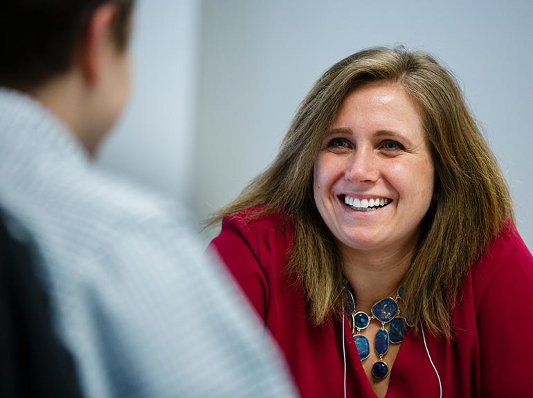 Students engage in a listening exercise during a "Coach Approach to Management."