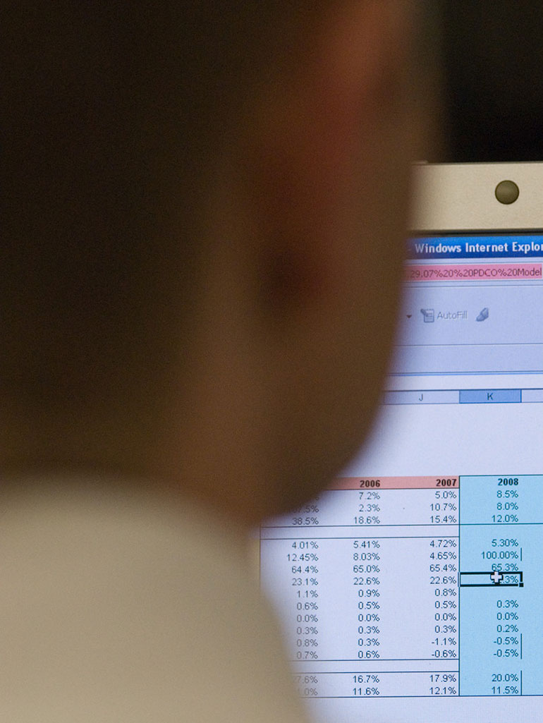 A student inputs numerical values on an excel spreadsheet. 