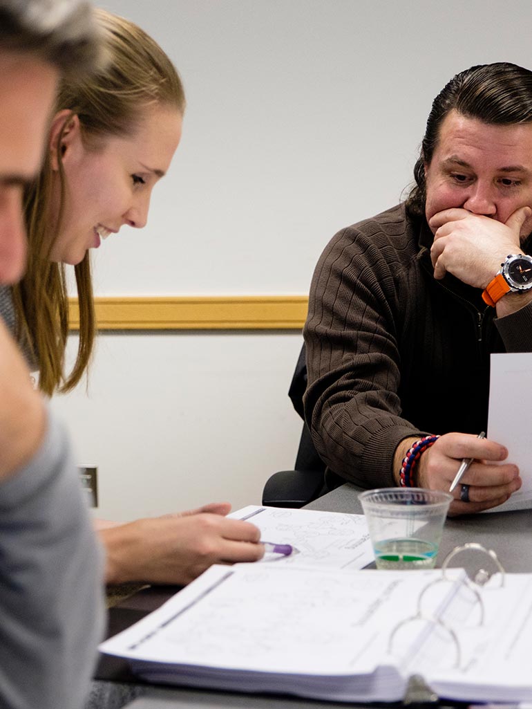 Students work together on an assignment during Class in Terence Murphy Hall.