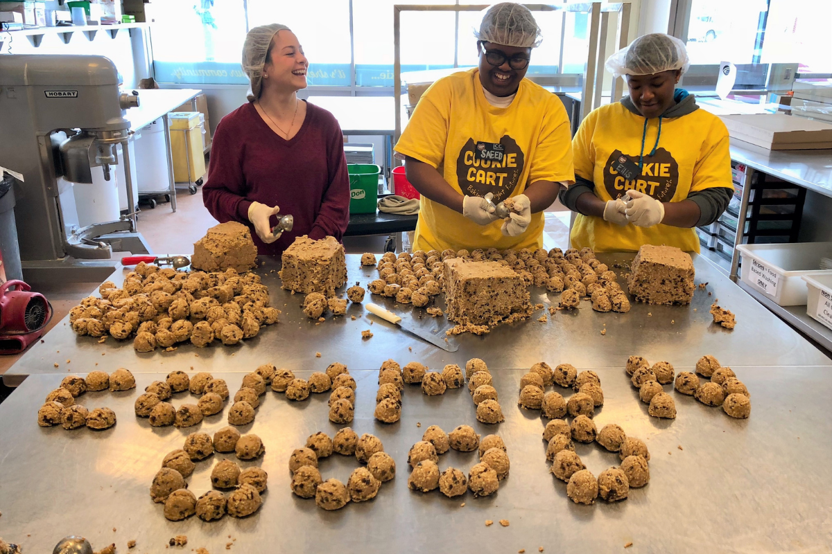 Student volunteer making cookies