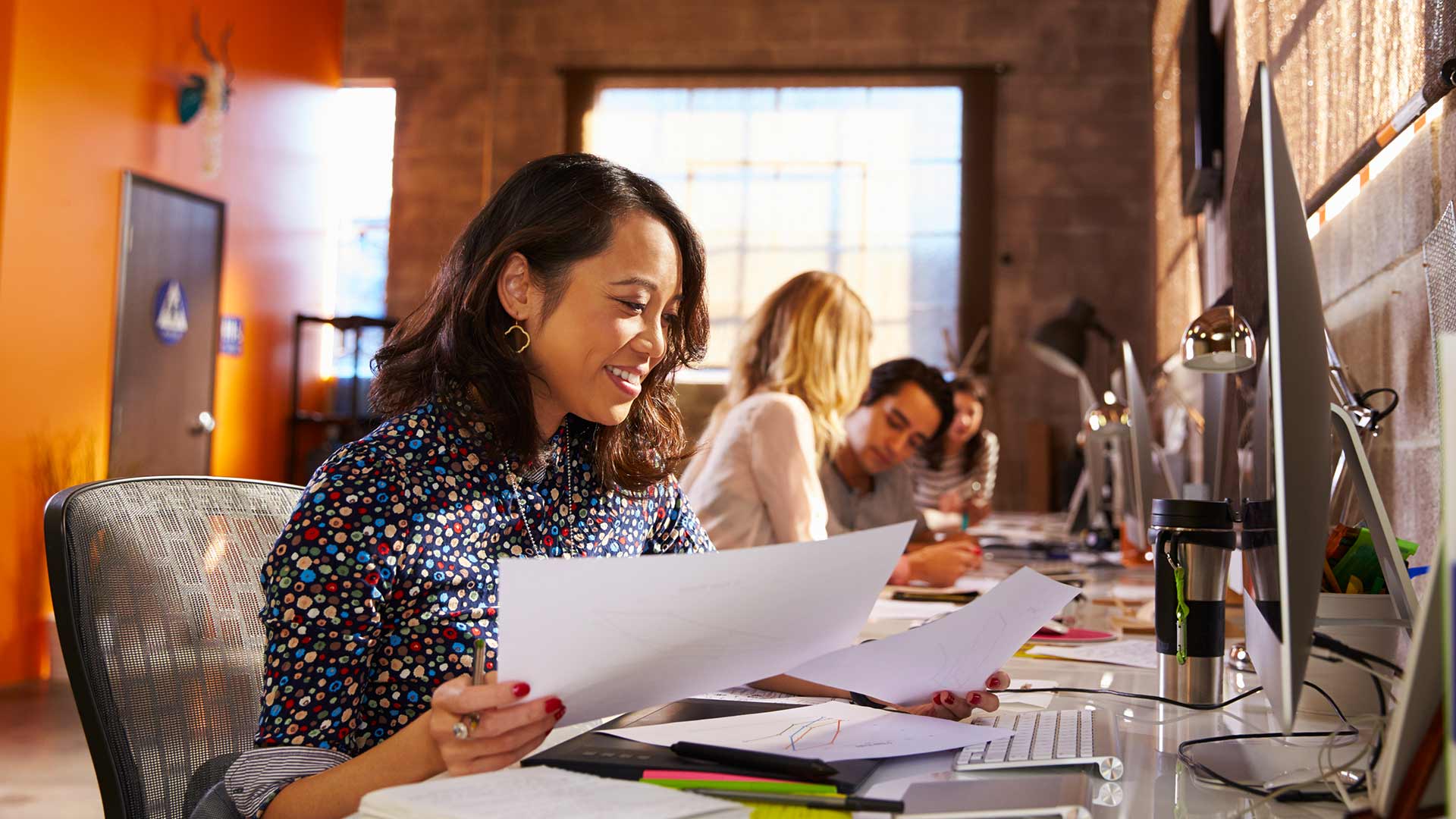 A team of professionals working in a modern office.