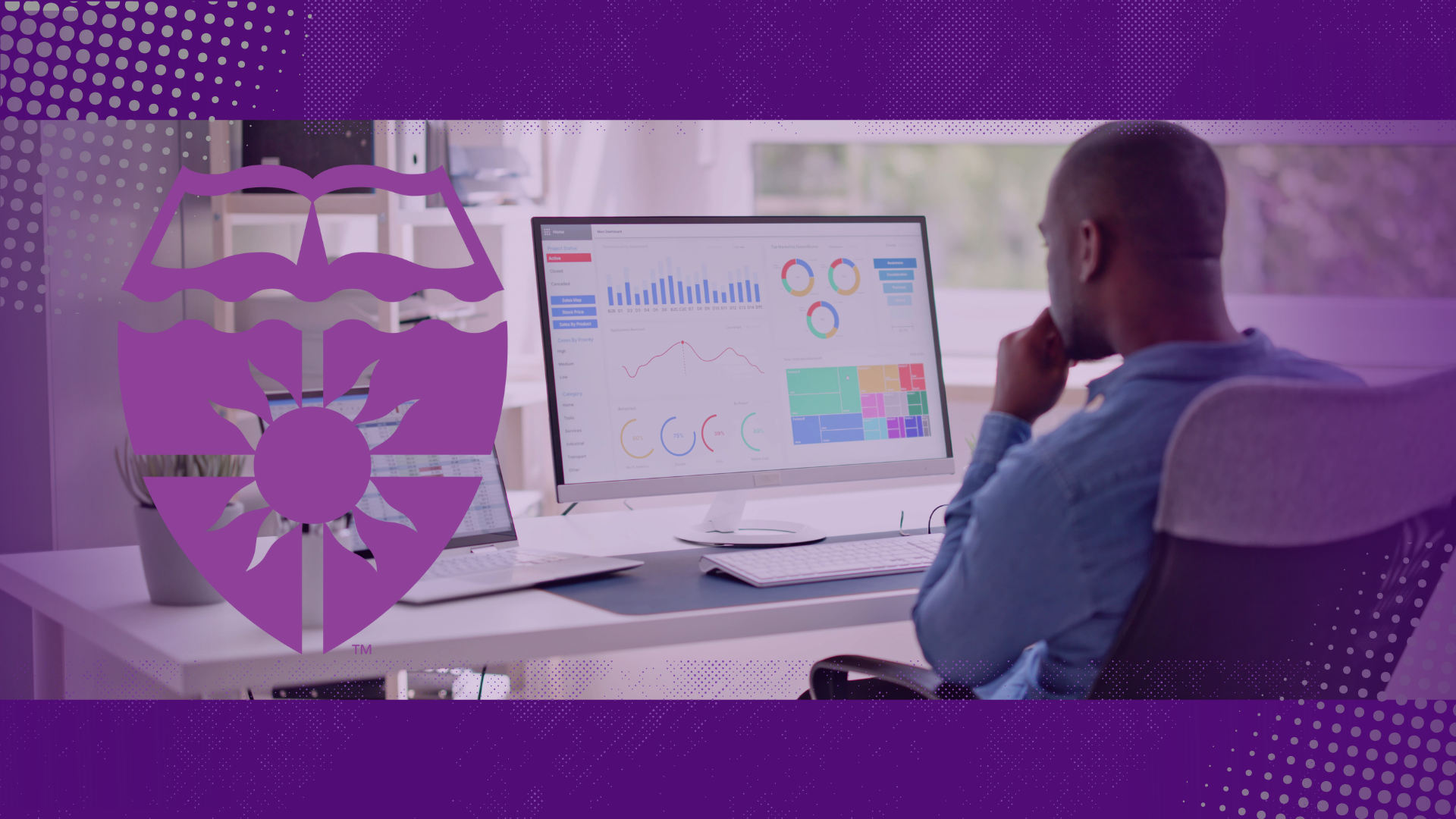 user sits at computer looking at data dashboards