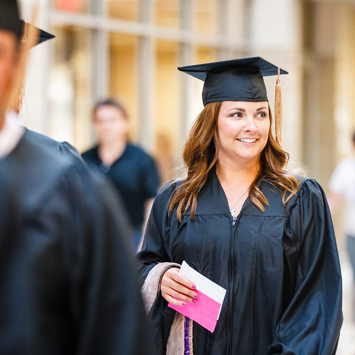 Student at Opus College of Business commencement ceremony. 
