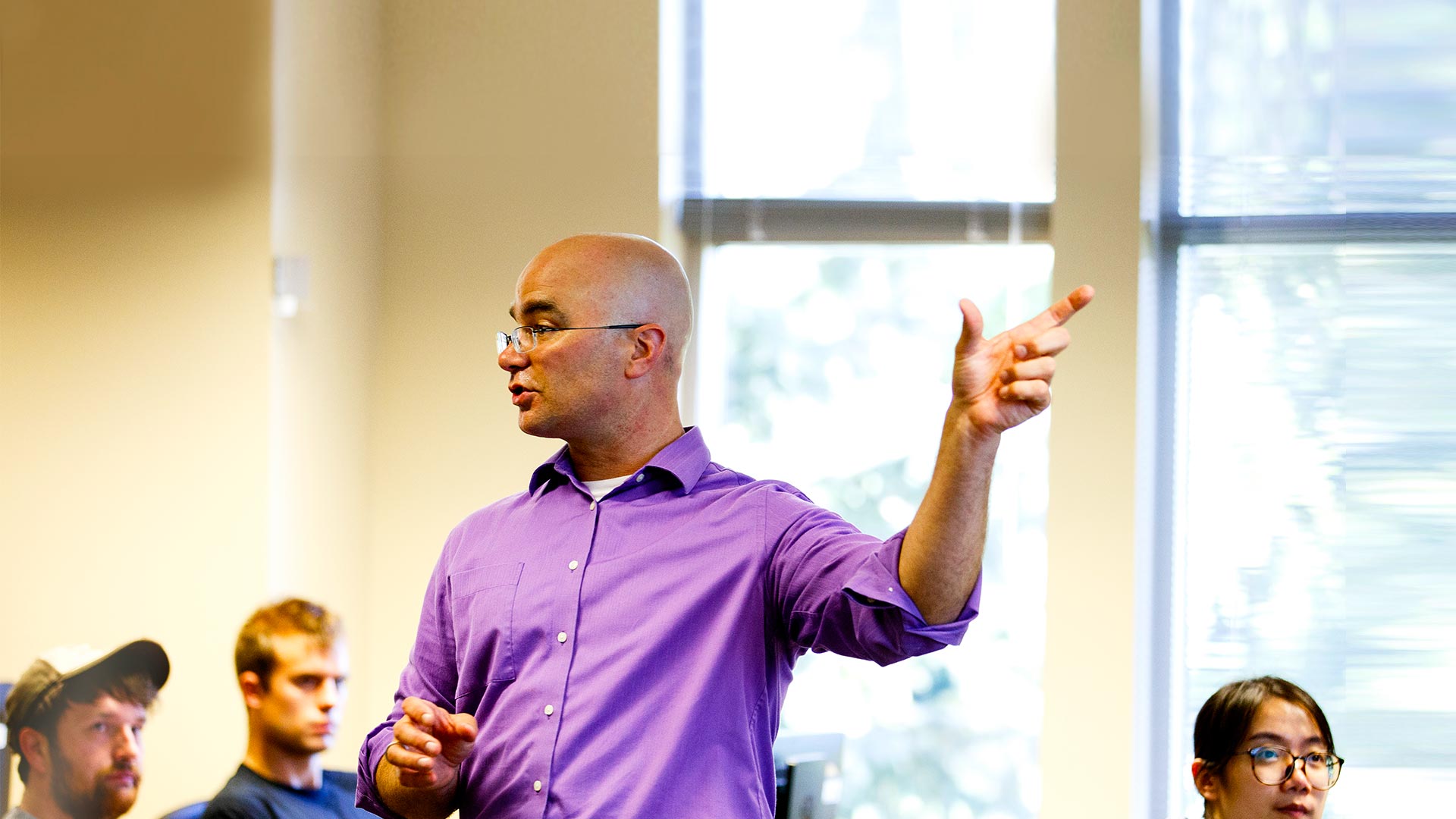 Professor teaching a class at the University of St. Thomas.