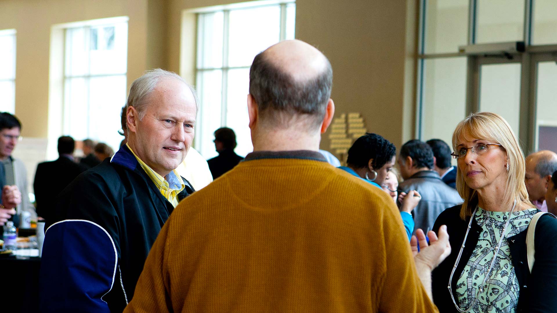 Faculty participates in research discussion to share work with one another.