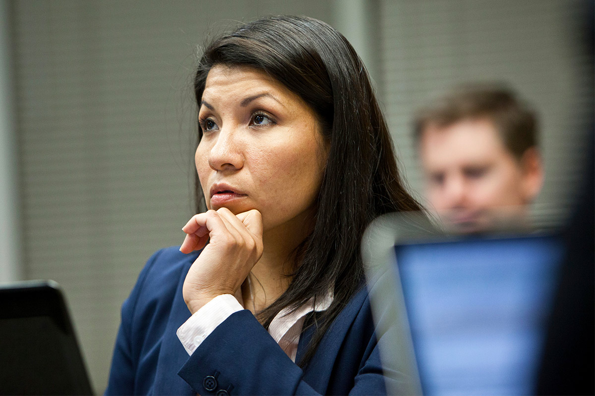 A professional listening attentively in classroom.