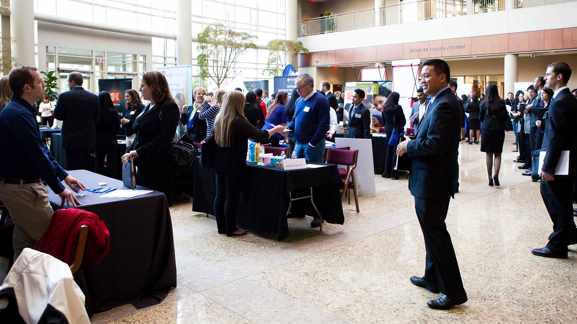 Students engage with employers at a career fair.