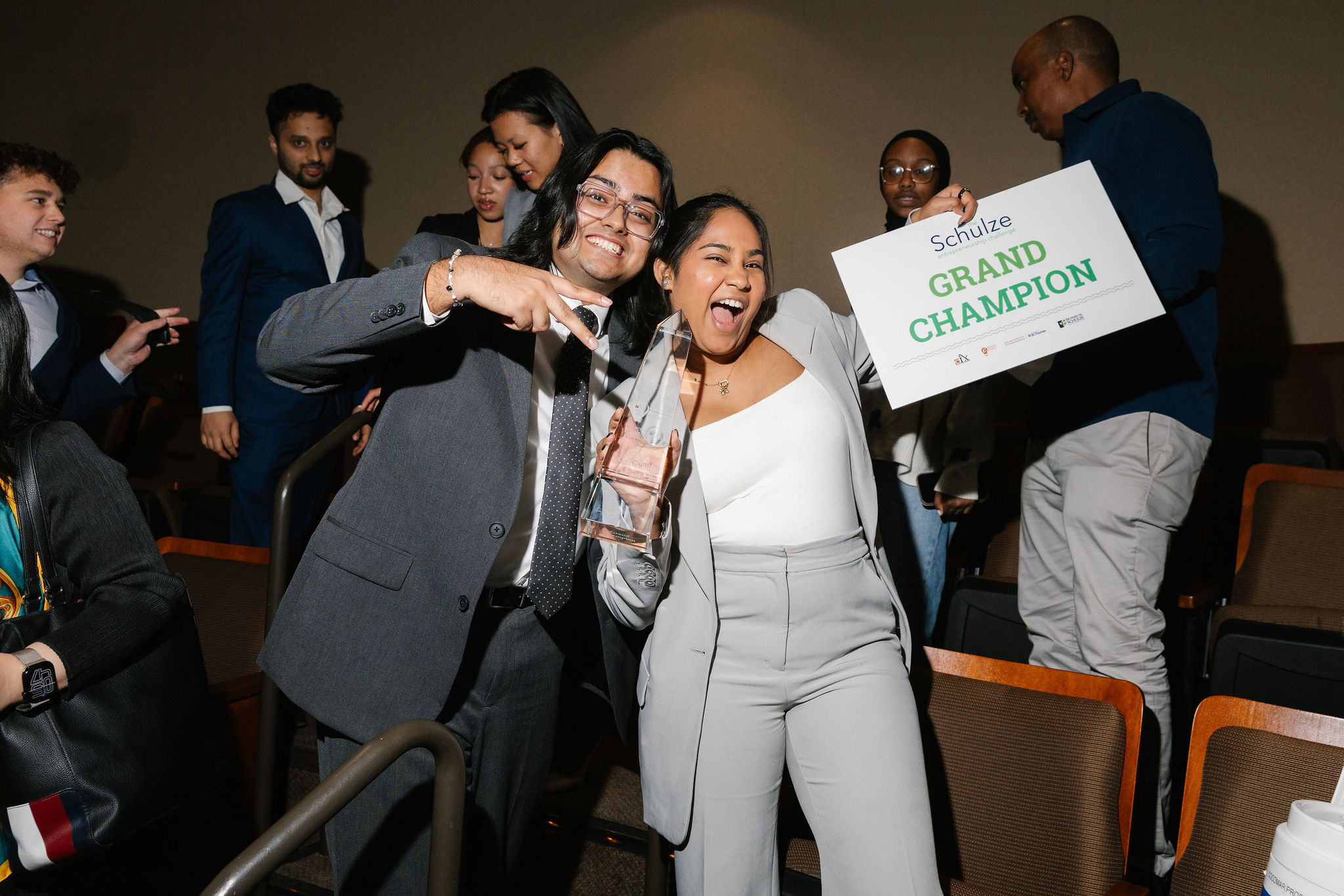 Student holding up the Grand Champions sign and trophy at e-Fest