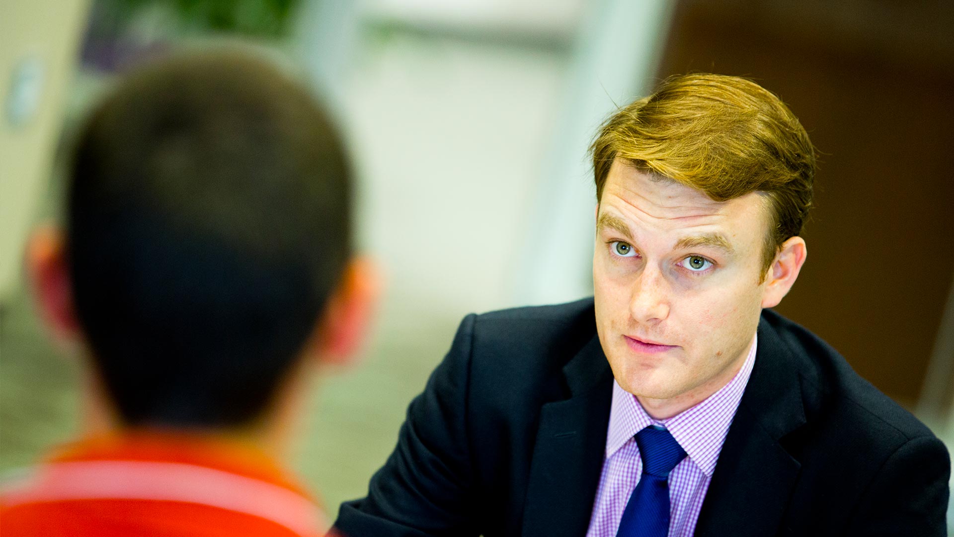 Business professional advising a student.