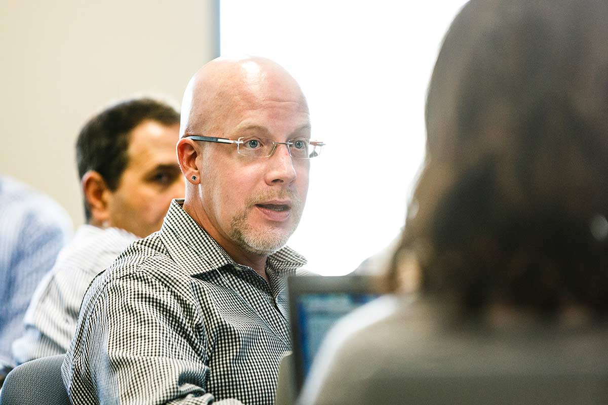 Two people engaged in a classroom discussion.
