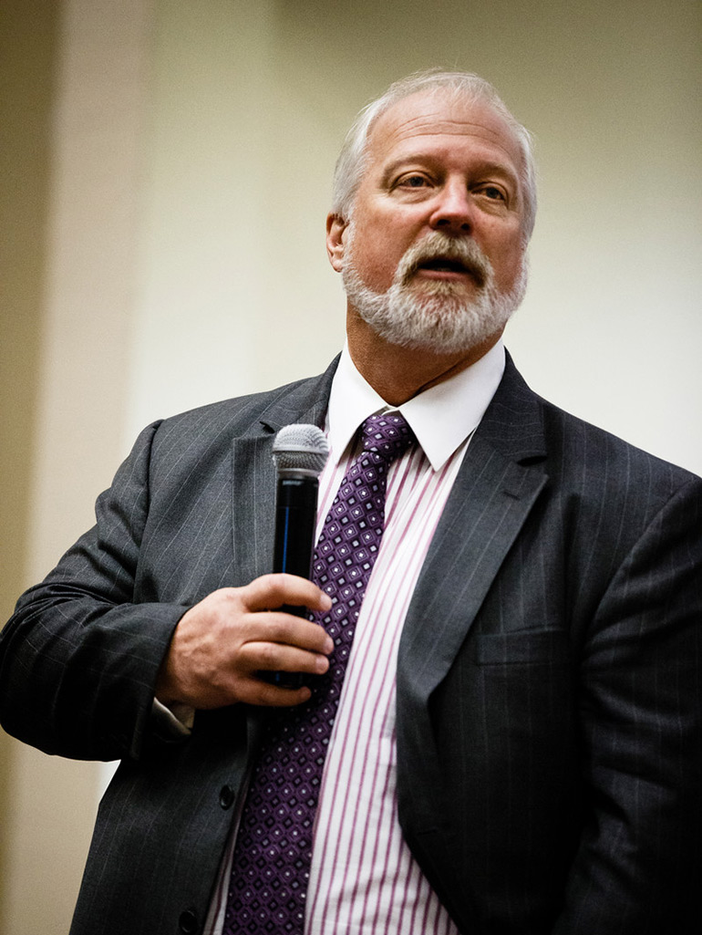 Opus College of Business professor David Deeds speaks in Schulze Hall auditorium during the Fowler Business Challenge.