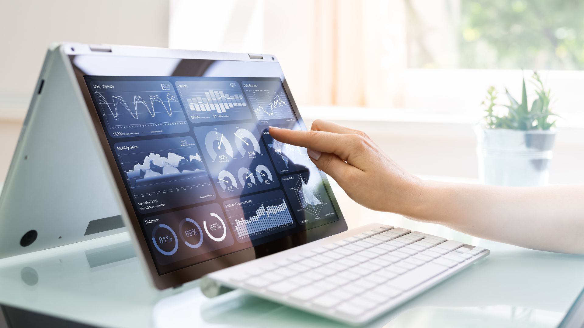 A person pointing at a chart on an ipad