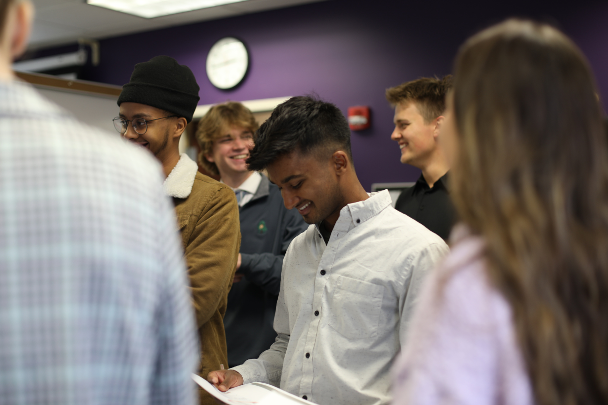 Students working together at Damus Board event