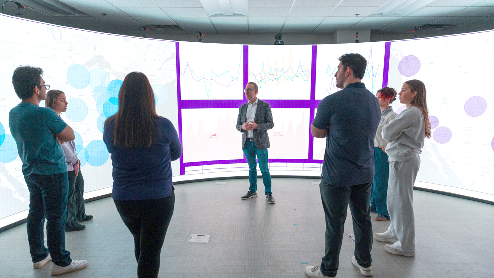 Students looking at data board