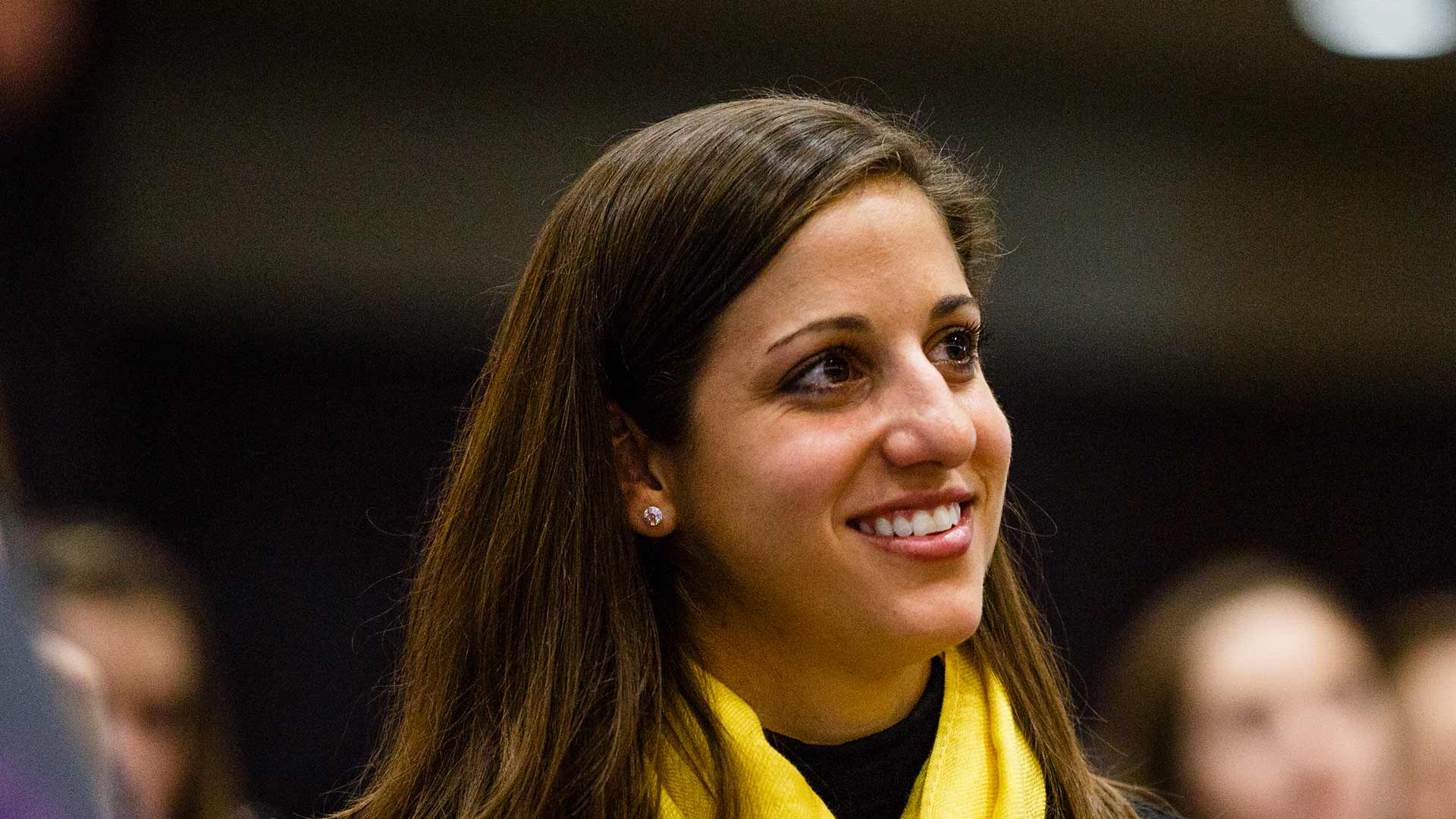 An audience member listens to a speech during the 2016 Winning with Integrity Symposium.