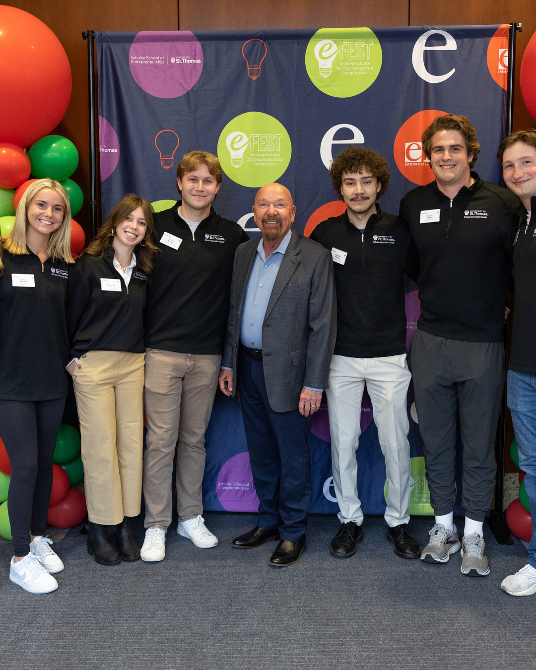 Ten Schulze Innovation Scholars pose for a photo with Dick Schulze.