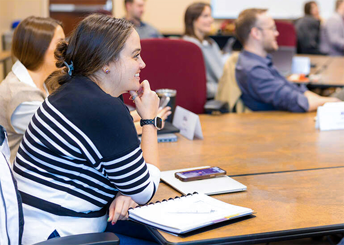 MBA students in a classroom setting on campus