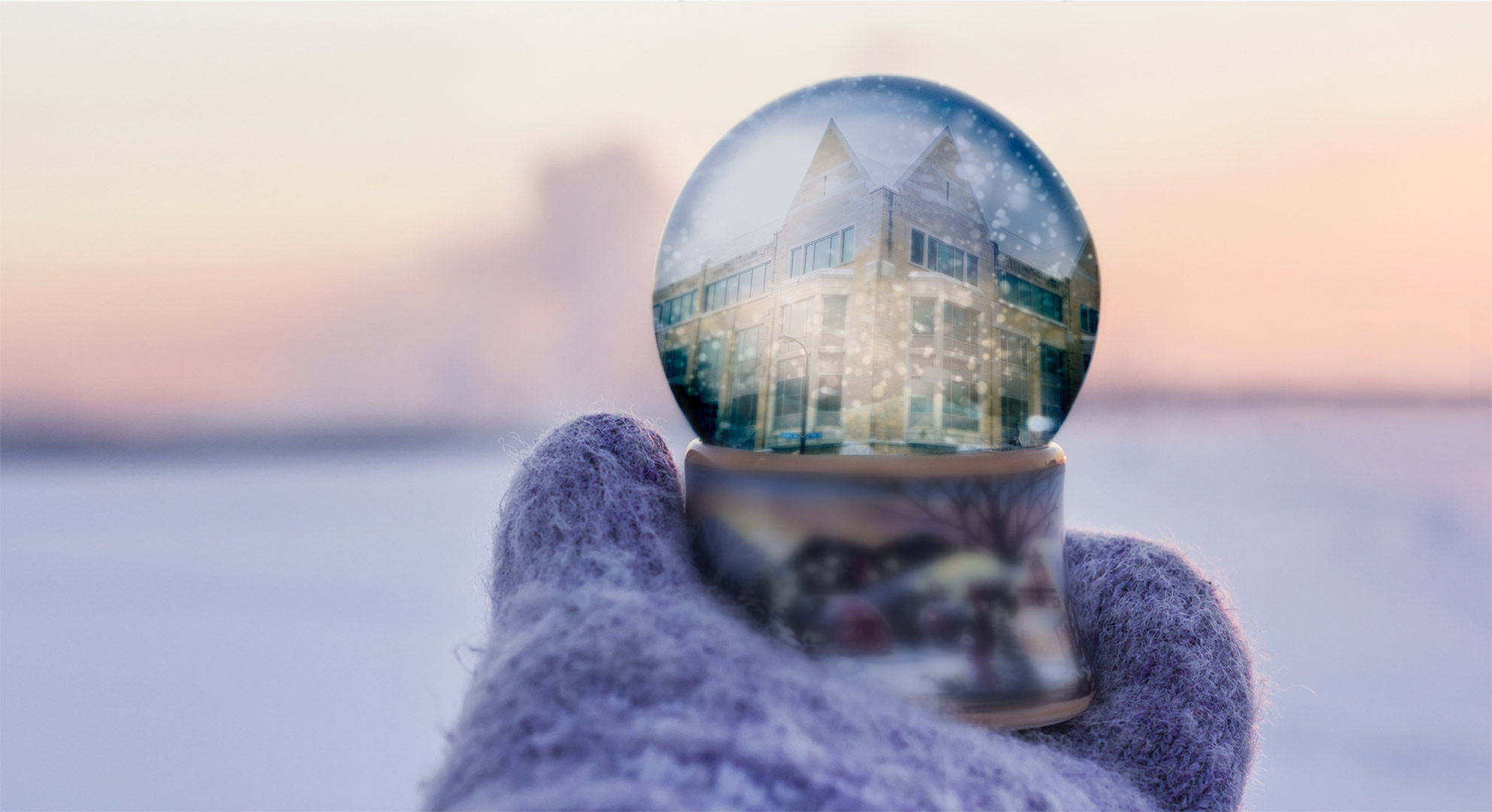 Close up snow globe with a reflection of Opus campus.