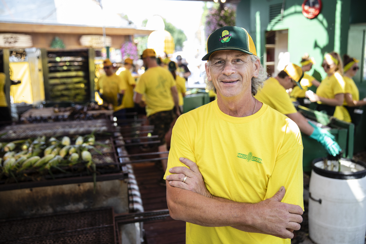Brad Ribar '82 MBA poses for a portrait at the Corn Roast stand at the Minnesota State Fair