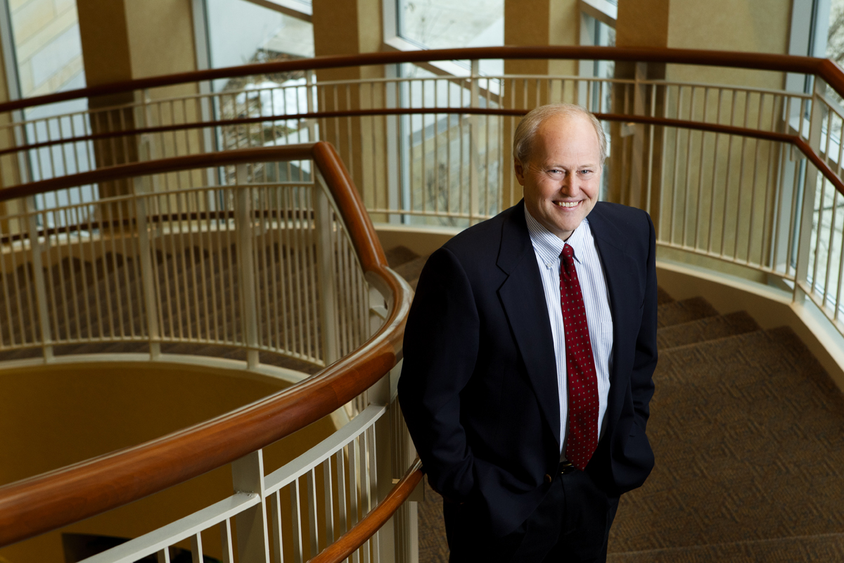 Opus professor posing in Terrence Murphy Hall in downtown Minneapolis