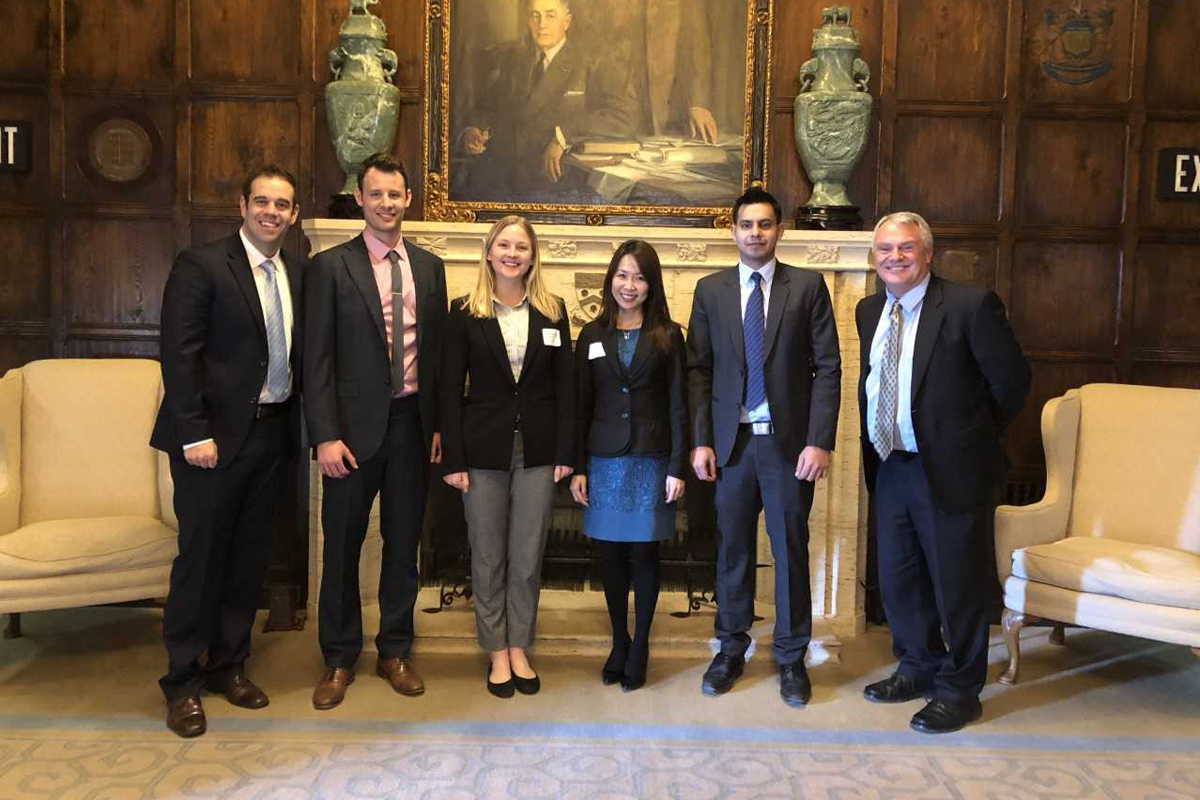 Business professor and students at Mayo Innovation Scholars Program