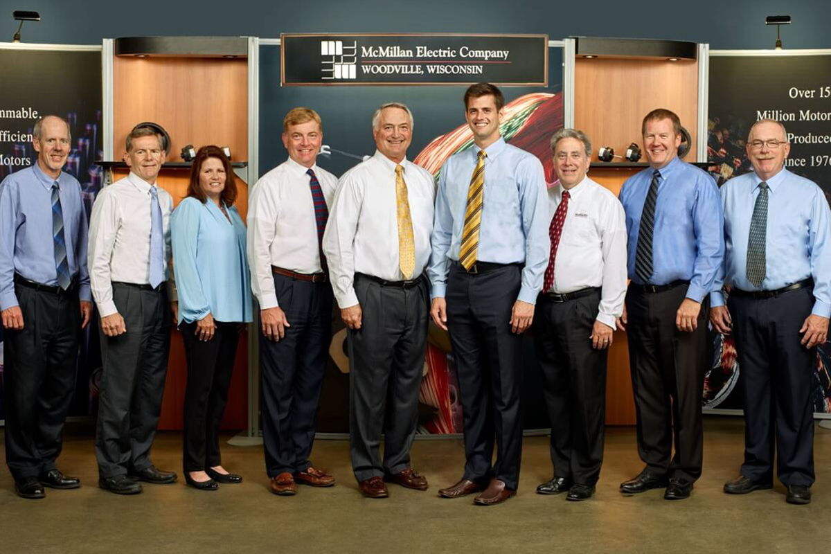 The leadership team of McMillan Electric pose at the company headquarters