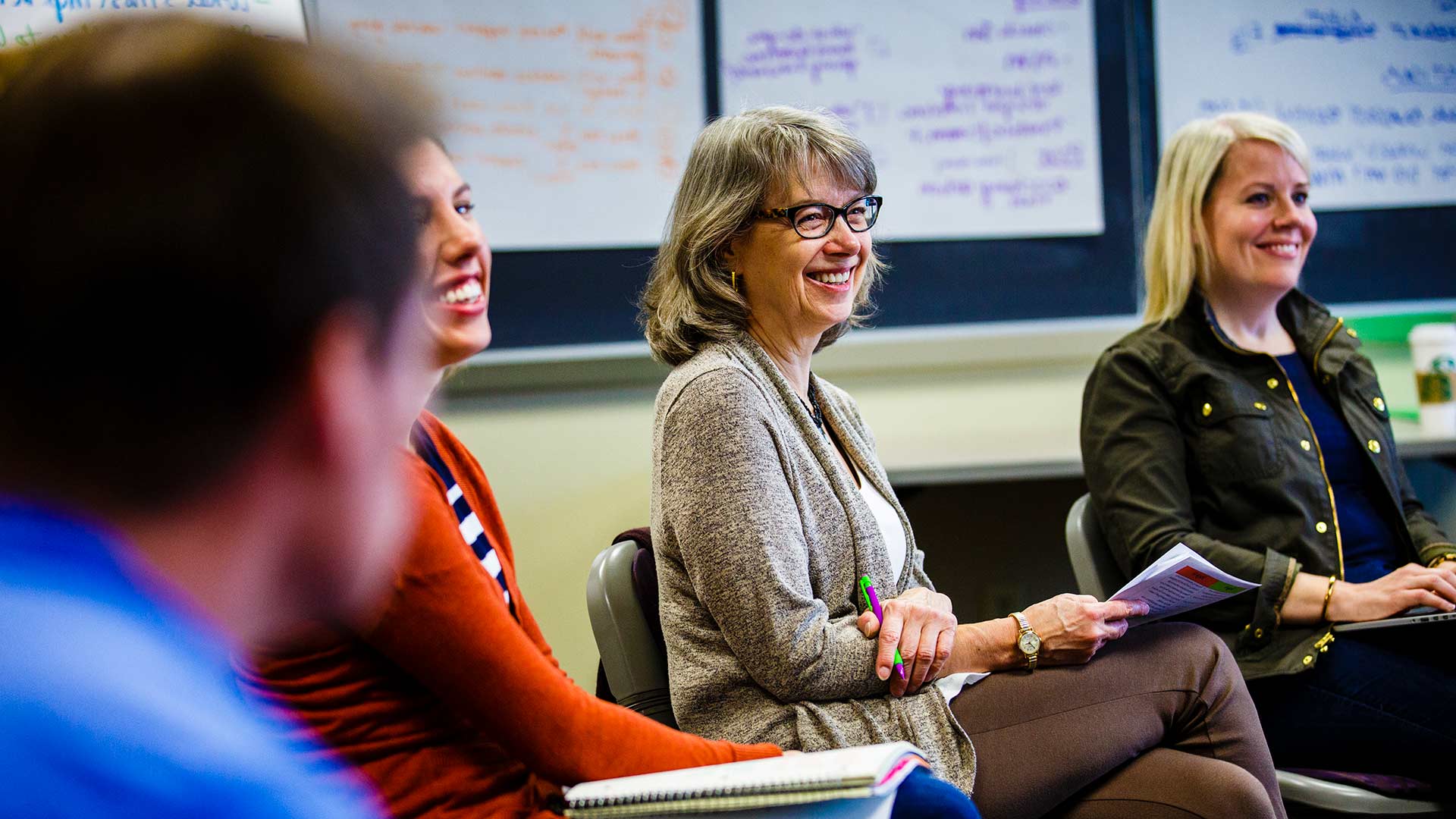 Instructor Bev Lutz laughs during an executive class in Opus Hall.